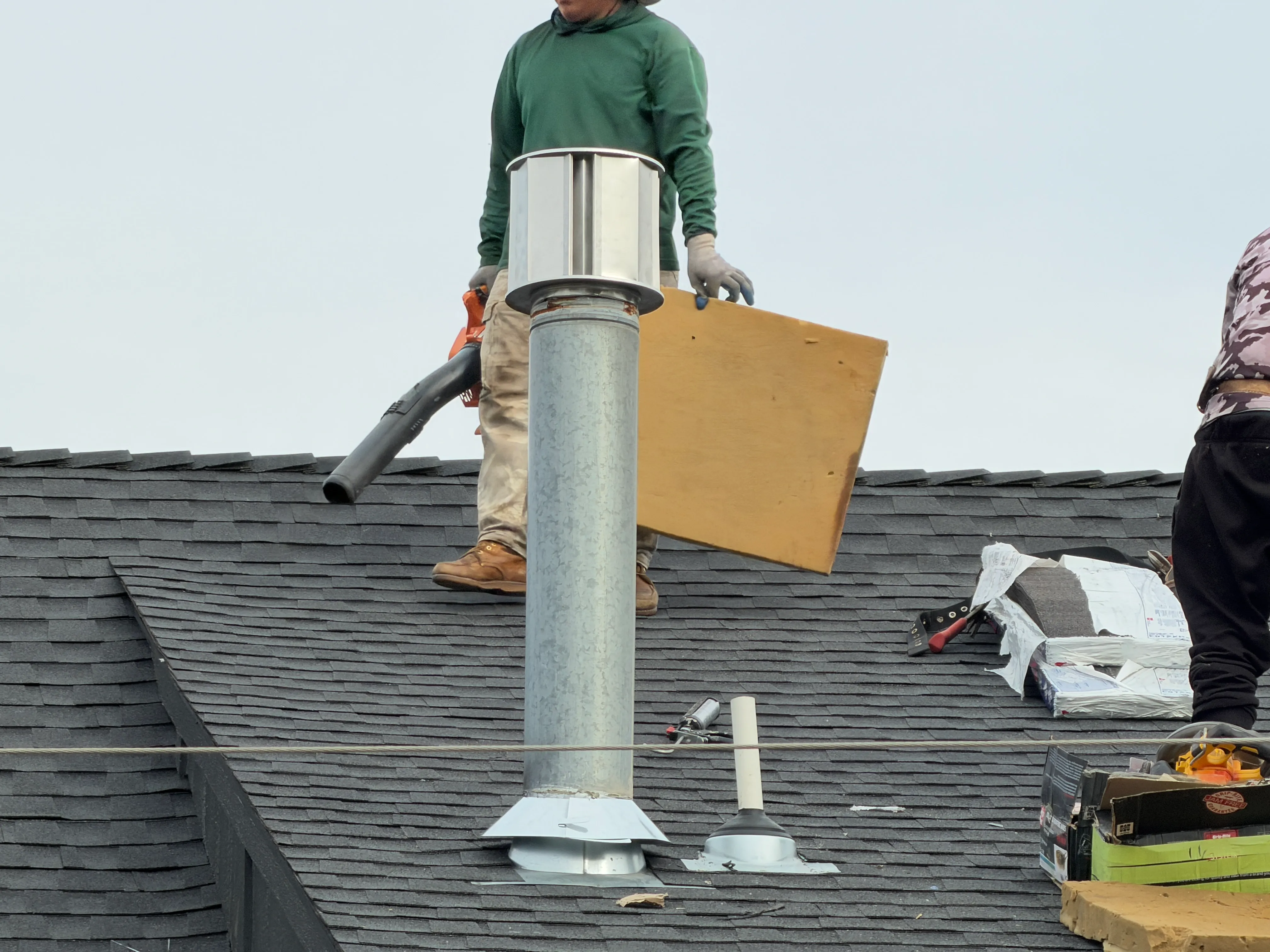 Downtown OKC Commercial Roof Replacement - man on the roof installing